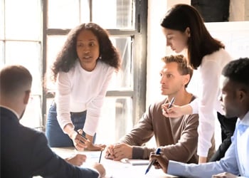 Collaborative team meeting around table